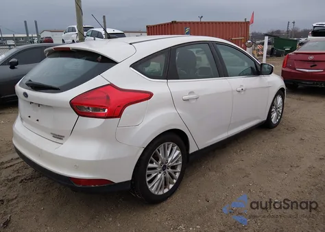 2015 Ford Focus Titanium z USA, uszkodzony, nr VIN 1FADP3N20FL378745